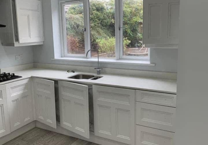 Kitchen cabinet doors being professionally spray painted on site